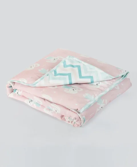 pink bunny print AC quilt with blue chevron lining prnt